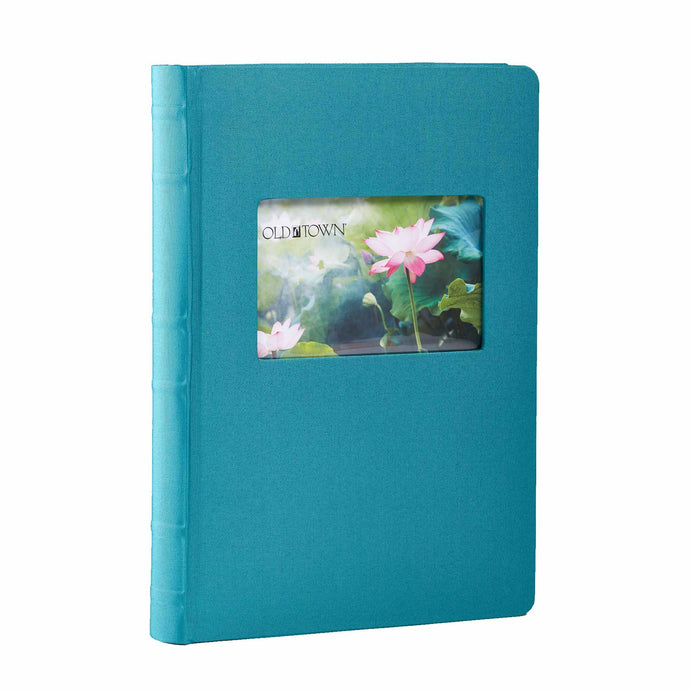 Single teal blue fabric photo album with 4x6 inch window for displaying photo.