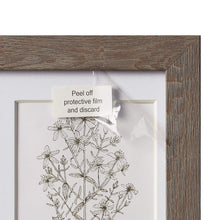 Load image into Gallery viewer, Frame board close up showing the peel off sticker that says &quot;Peel off protective film and discard&quot;.
