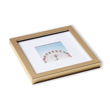 Load image into Gallery viewer, A single gold frame resting on white surface.
